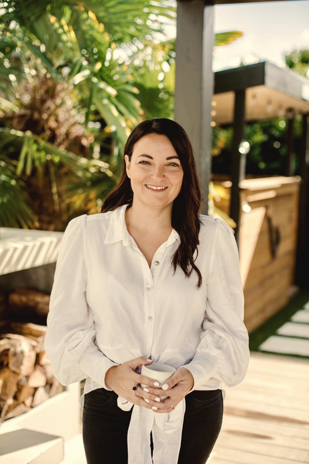 Vicki, owner of The i-Brow Room, standing outside smiling