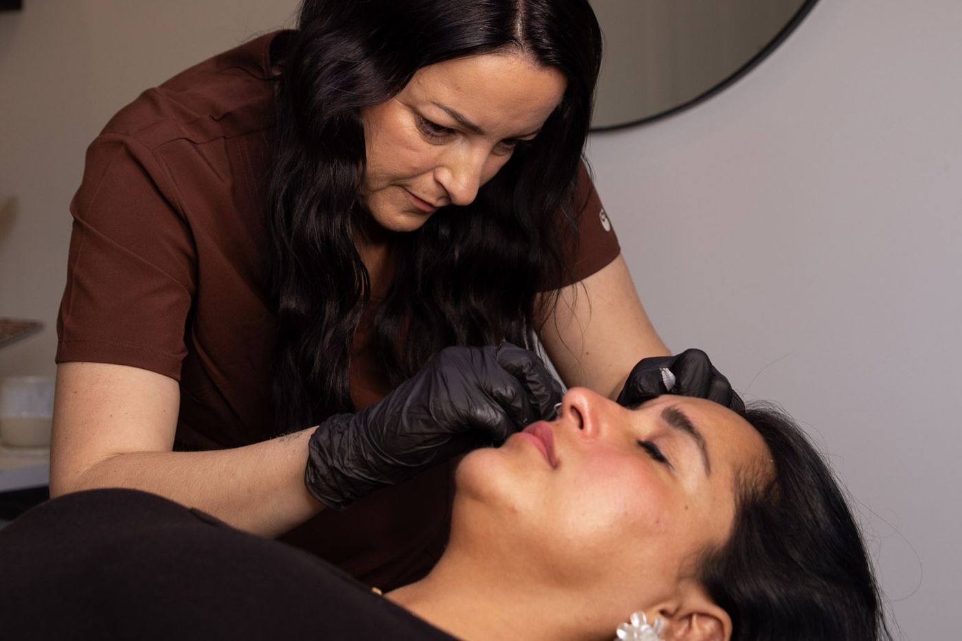 Vicki performing a lip blushing treatment in the studio